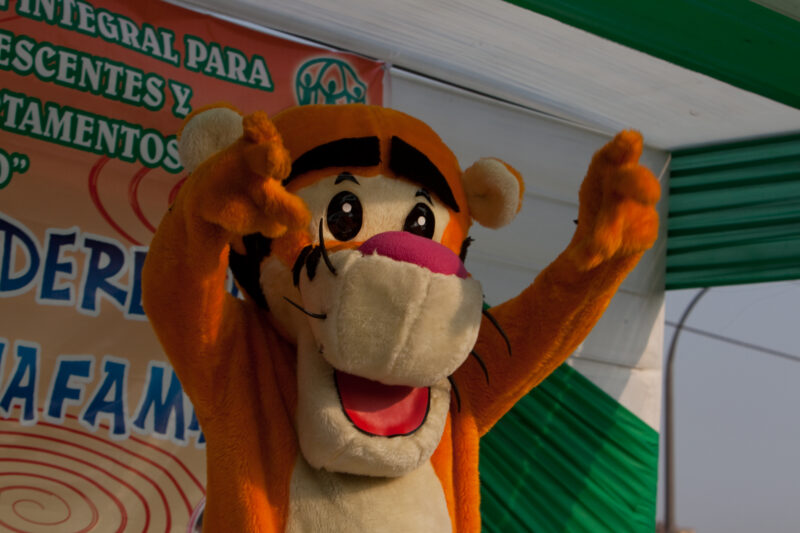 Teaching Social and Life Skills — Using songs and skits, at a rally set up in a poor community near Lima, teaches children and parents life skills — Peru, AD...