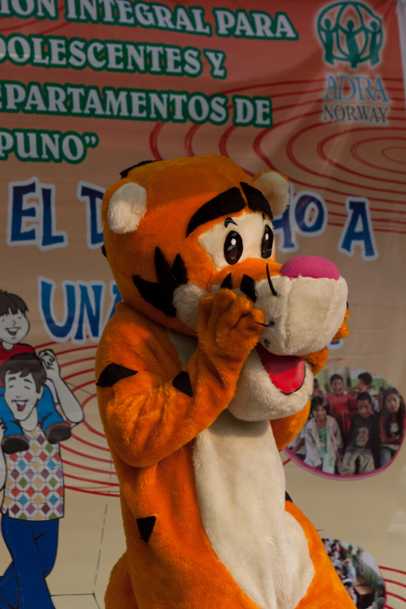 Teaching Social and Life Skills — Using songs and skits, at a rally set up in a poor community near Lima, teaches children and parents life skills — Peru, AD...