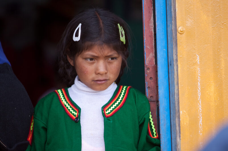 School Prayer — Stock images of the life of the Uro people group, living on the floating reed islands of Lake Titicaca, near Puno, Peru: Children pause for m...