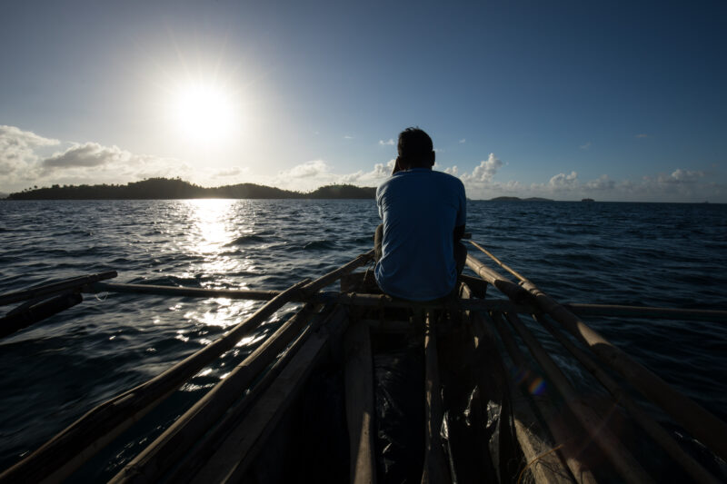 Going Fishing — Fishermen head out in the evening light for a night of fishing. — Philippines, Camarines Sur, Luzon, fishing, boat
