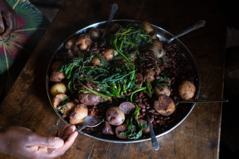 Nutritious Meal — A plate of potatoes, beans and greens, about to be shared by a family in Rwanda. — Rwanda, Africa, Animals, Topi, Antelope
