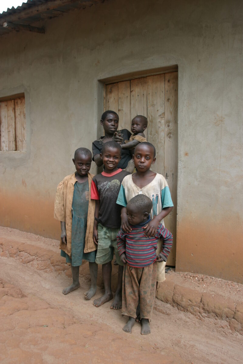 Family Group in Rwanda — People returning to Rwanda after the genocide was overreclaim land in a unpopulated swampy area, with technology and financial suppo...