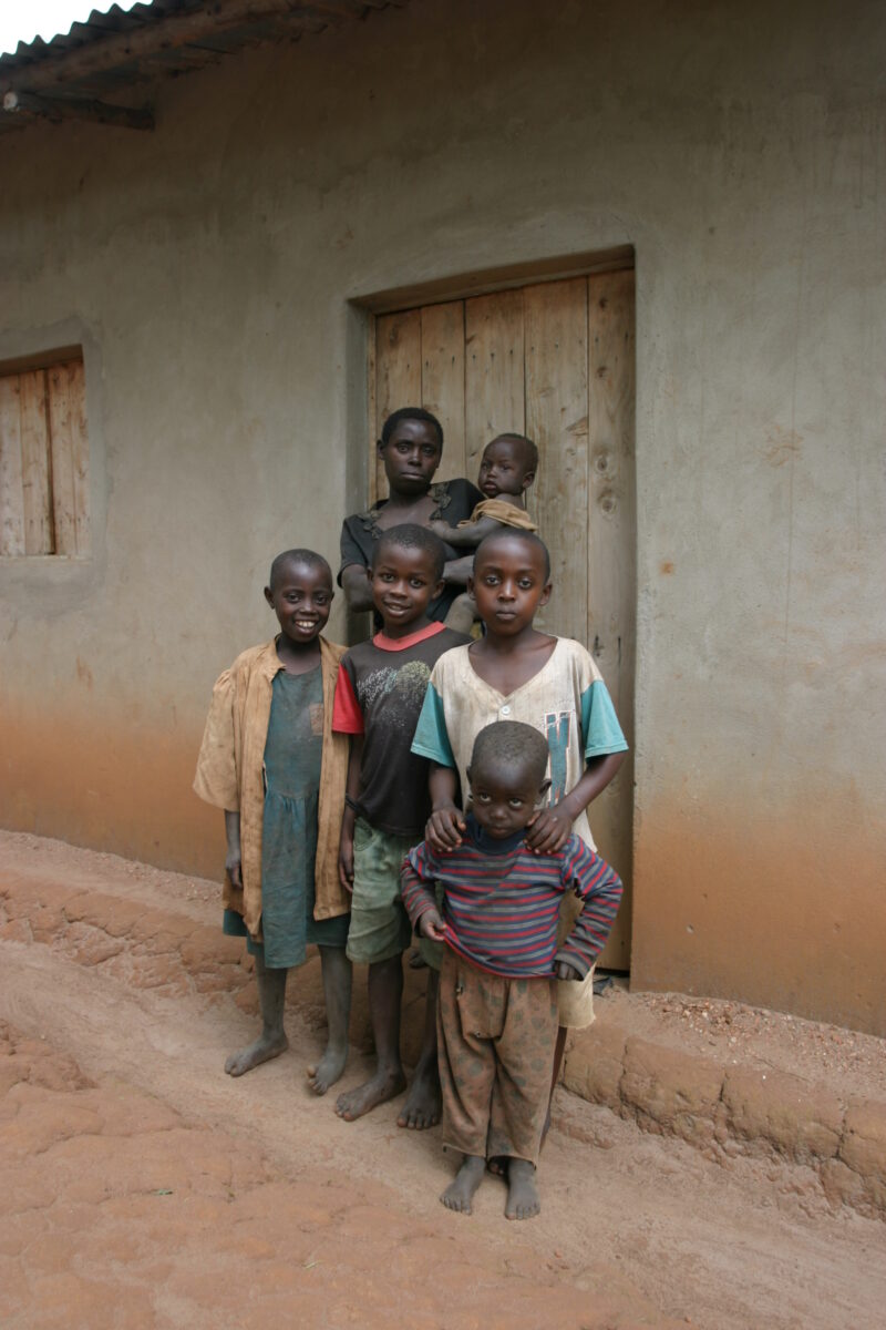 Family Group in Rwanda — People returning to Rwanda after the genocide was overreclaim land in a unpopulated swampy area, with technology and financial suppo...