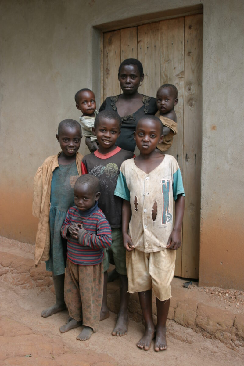 Family Group in Rwanda — People returning to Rwanda after the genocide was overreclaim land in a unpopulated swampy area, with technology and financial suppo...