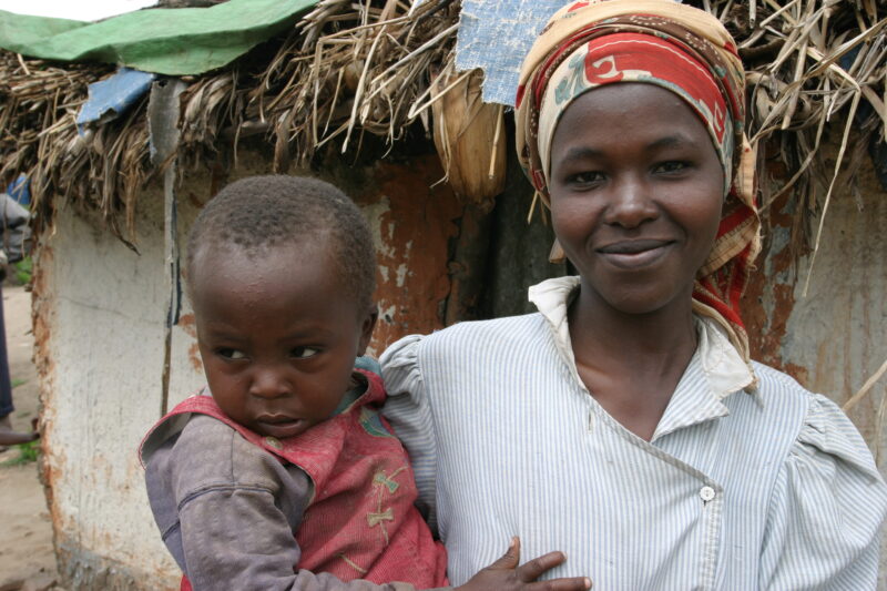 Mother and Baby in Rwanda — People returning to Rwanda after the genocide was overreclaim land in a unpopulated swampy area, with technology and financial su...