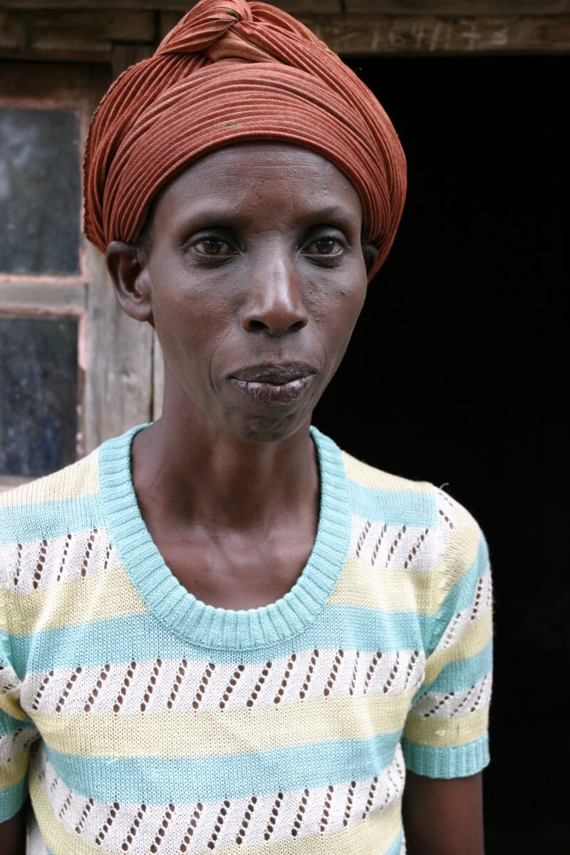 Woman in Rwanda — People returning to Rwanda after the genocide was overreclaim land in a unpopulated swampy area, with technology and financial support from...