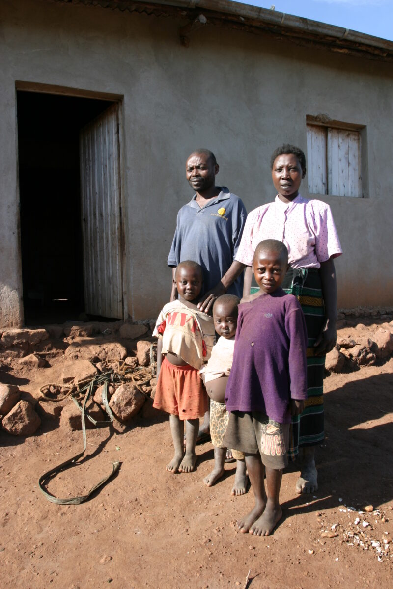 Family Group in Rwanda — People returning to Rwanda after the genocide was overreclaim land in a unpopulated swampy area, with technology and financial suppo...