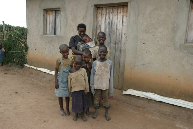 Family Group in Rwanda — People returning to Rwanda after the genocide was overreclaim land in a unpopulated swampy area, with technology and financial suppo...