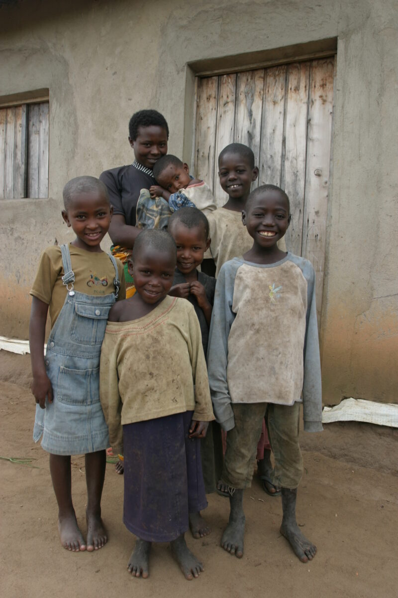 Family Group in Rwanda — People returning to Rwanda after the genocide was overreclaim land in a unpopulated swampy area, with technology and financial suppo...