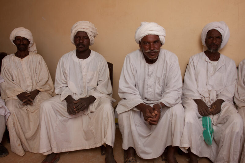 Men’s Group in Sudan — Men meet together to discuss the issues of the village in an ADRA directed "reflect" group meeting, in Sudan, Africa — Africa, S...
