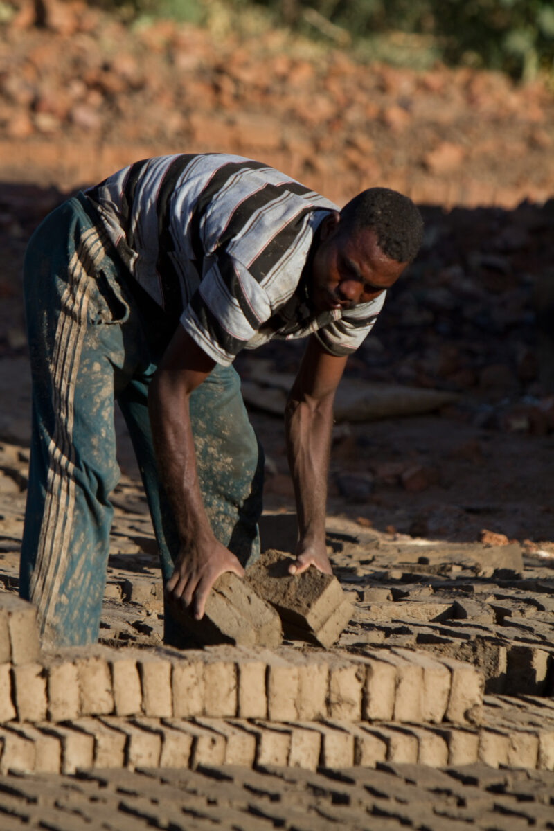 Making Bricks — Man lays out bricks to dry in Sudan, Africa — Africa, Sudan, work, workers, brick