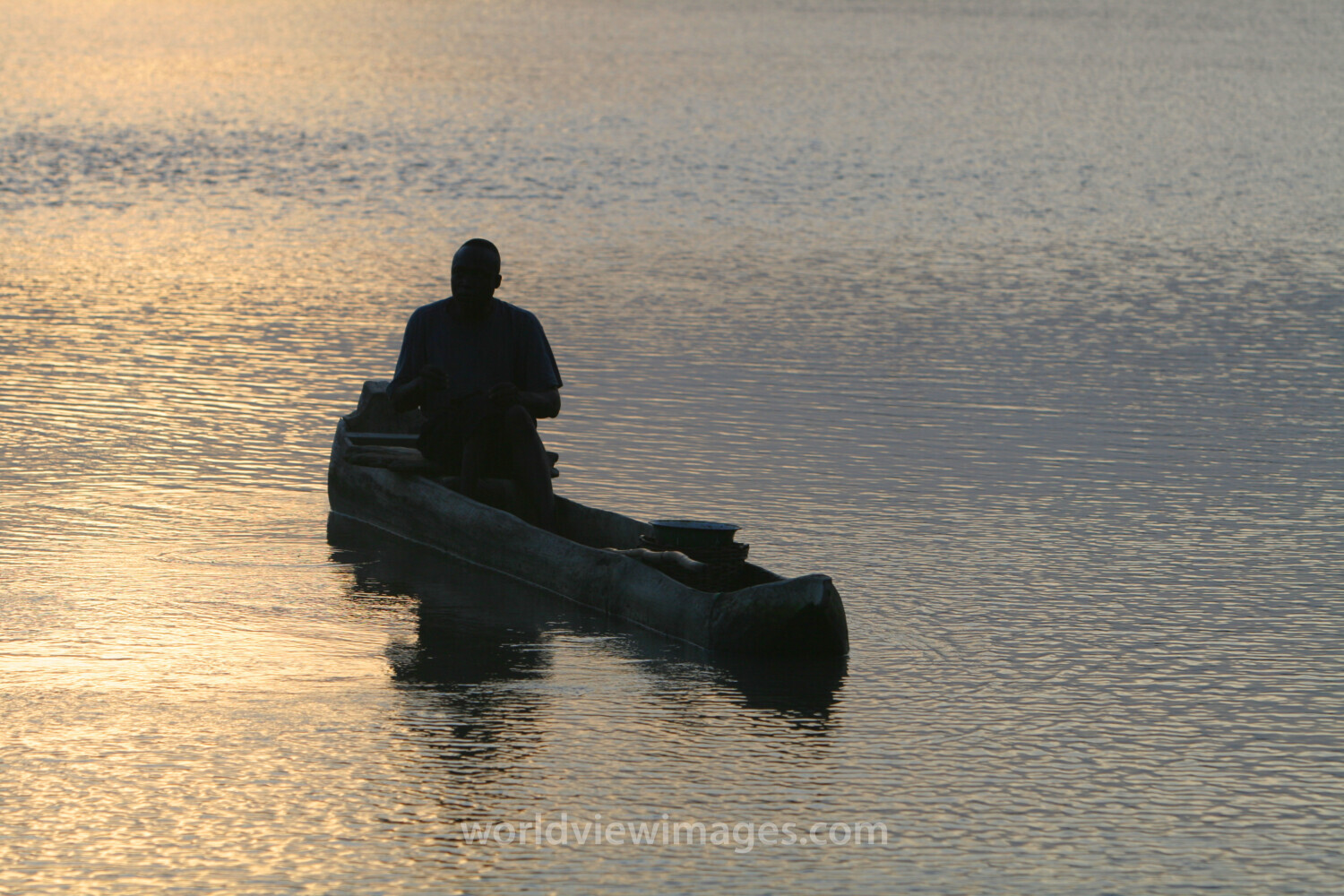 Man in Canoe in evening light