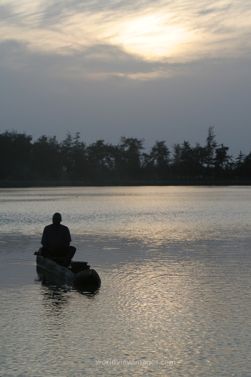 Man in Canoe in evening light