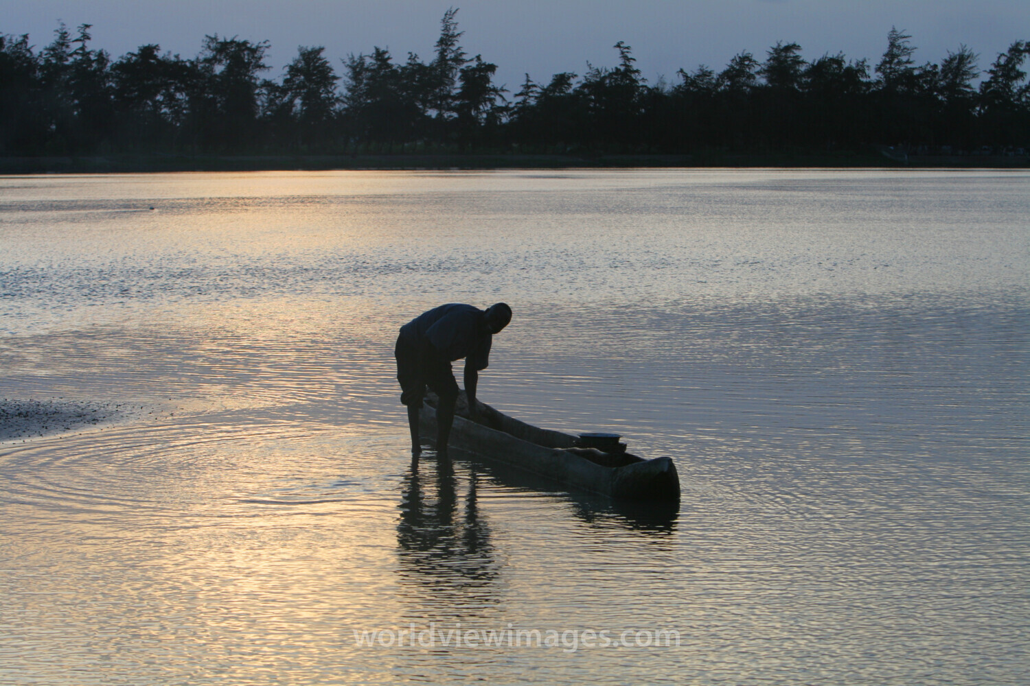 Man in Canoe in evening light