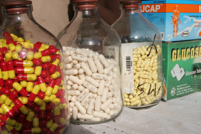 Drugs sold by person in Market — Togo, market, drugs, pills, pharmacuticals