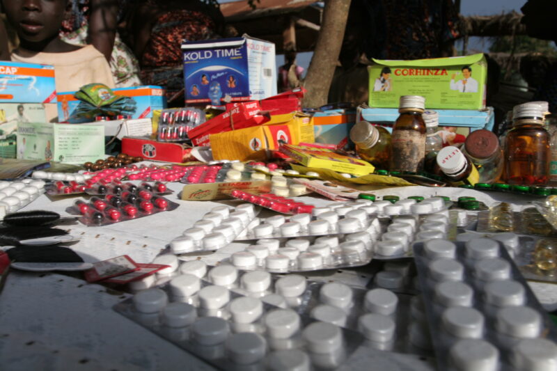 Drugs sold by person in Market — Togo, market, drugs, pills, pharmacuticals