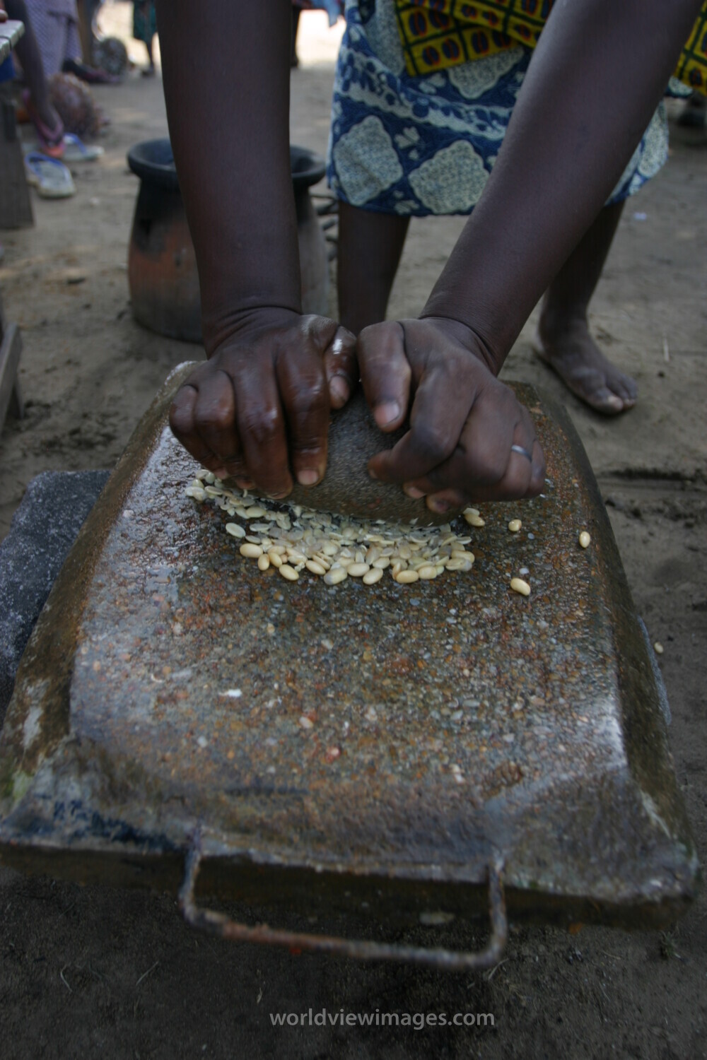 Grinding Maize on a Grinding Stone in Africa