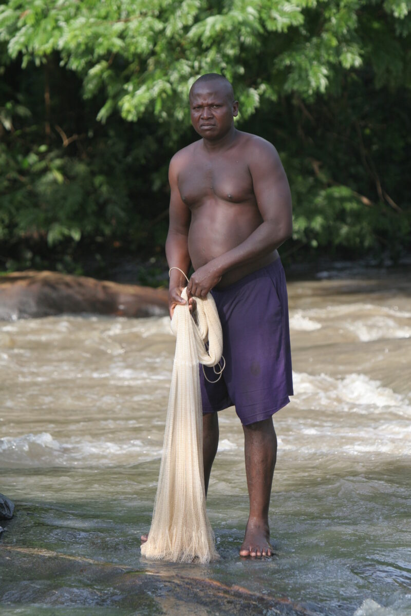 Net fishing in a River in Togo — Fishing with Nets in West Africa — Togo, Africa, West Africa, men, faces