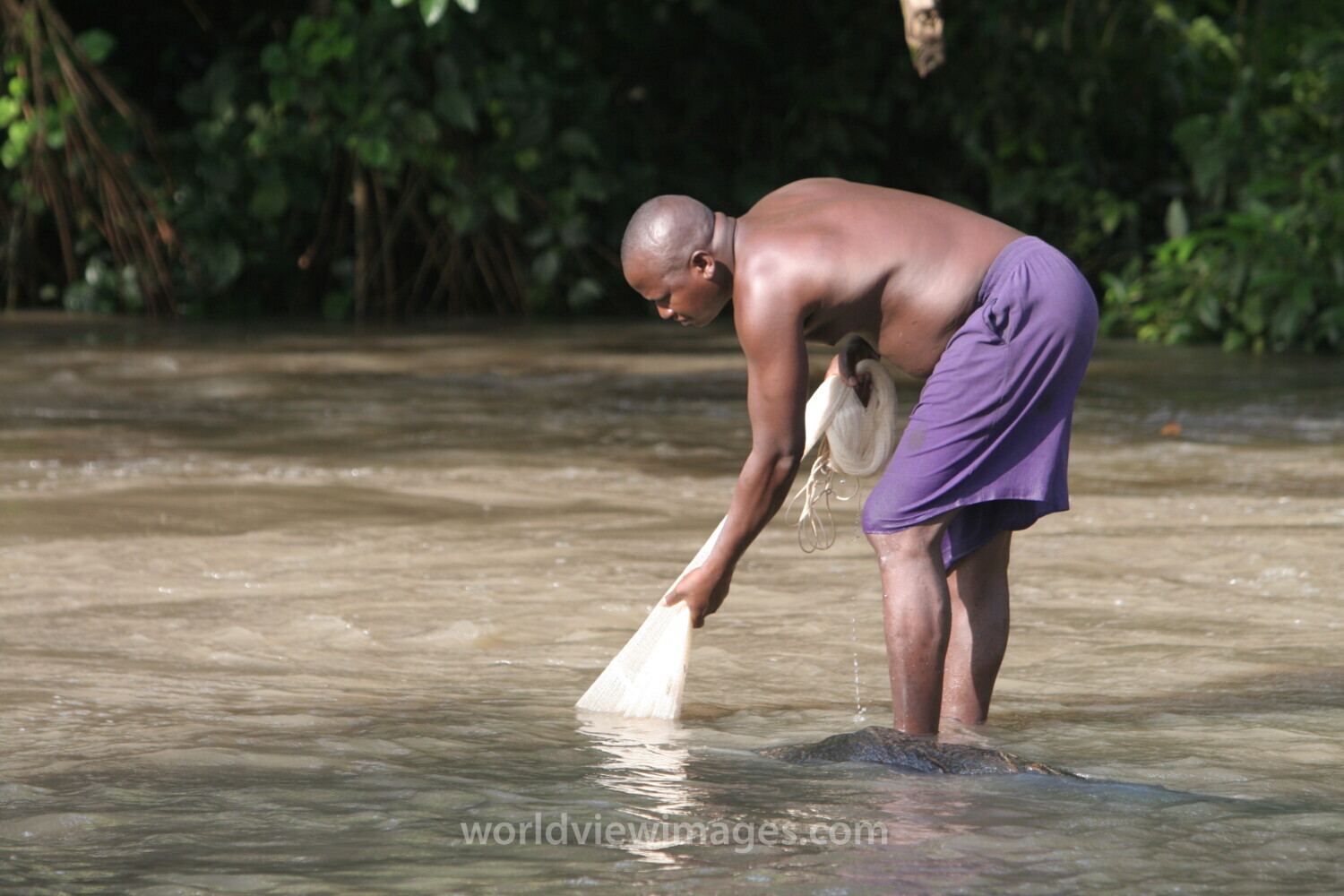 Net fishing in A River in Togo