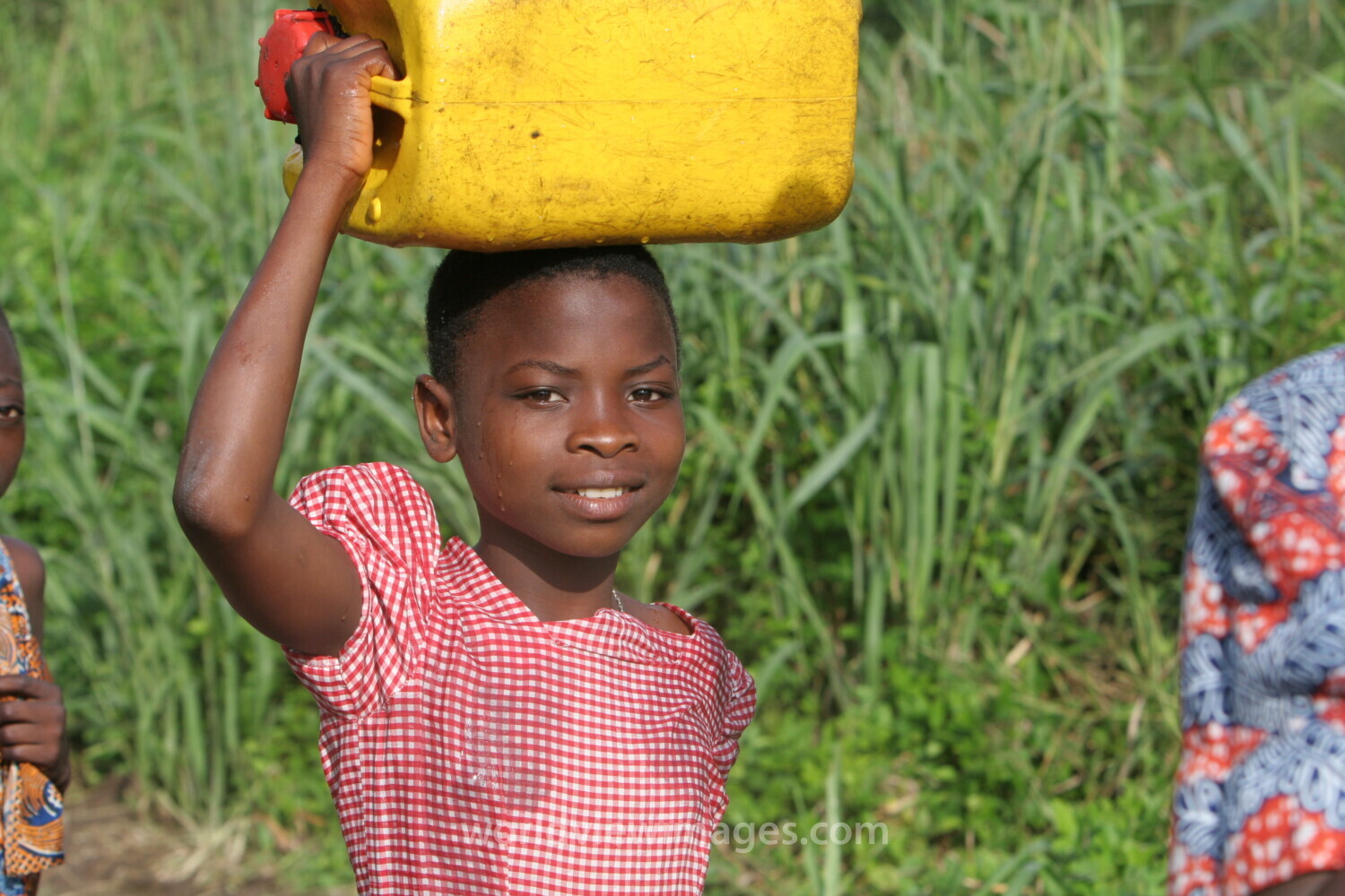 Doing Laundry in the River in Togo