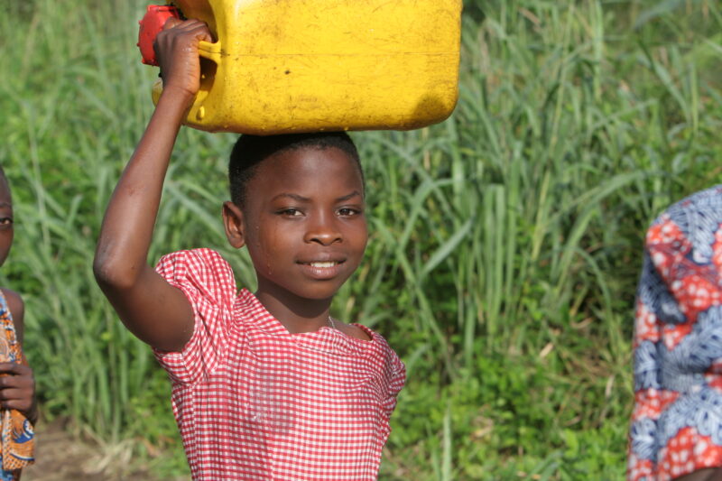 Doing Laundry in the River in Togo — Togo, Africa, West Africa, children, poor