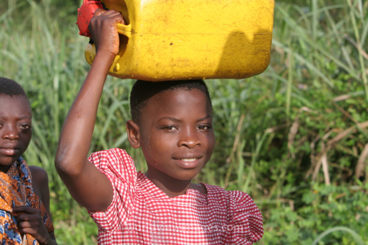 Doing Laundry in the River in Togo