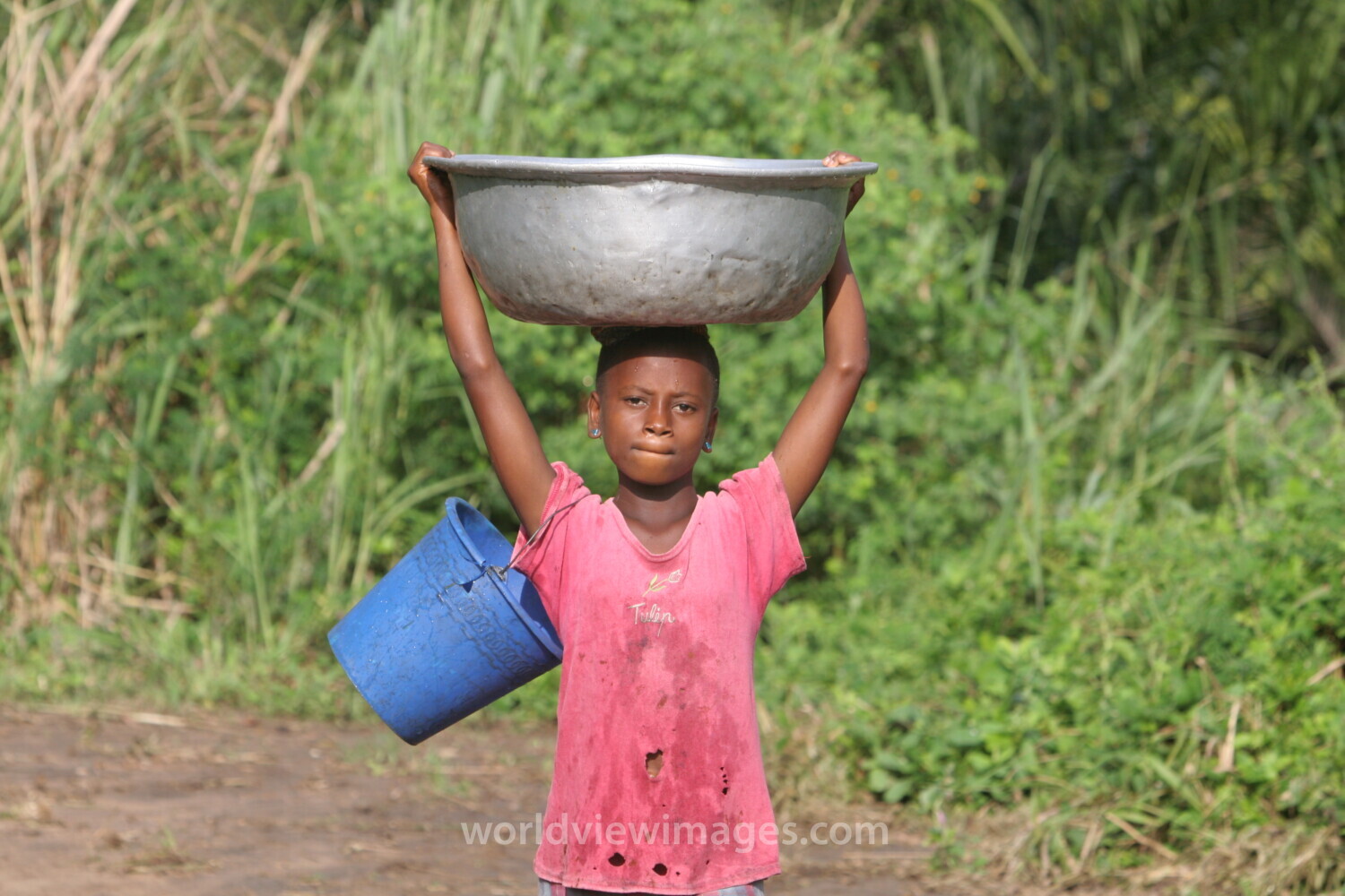 Doing Laundry in the River in Togo