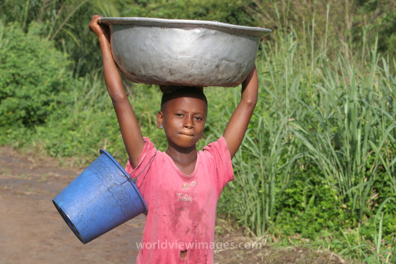 Doing Laundry in the River in Togo