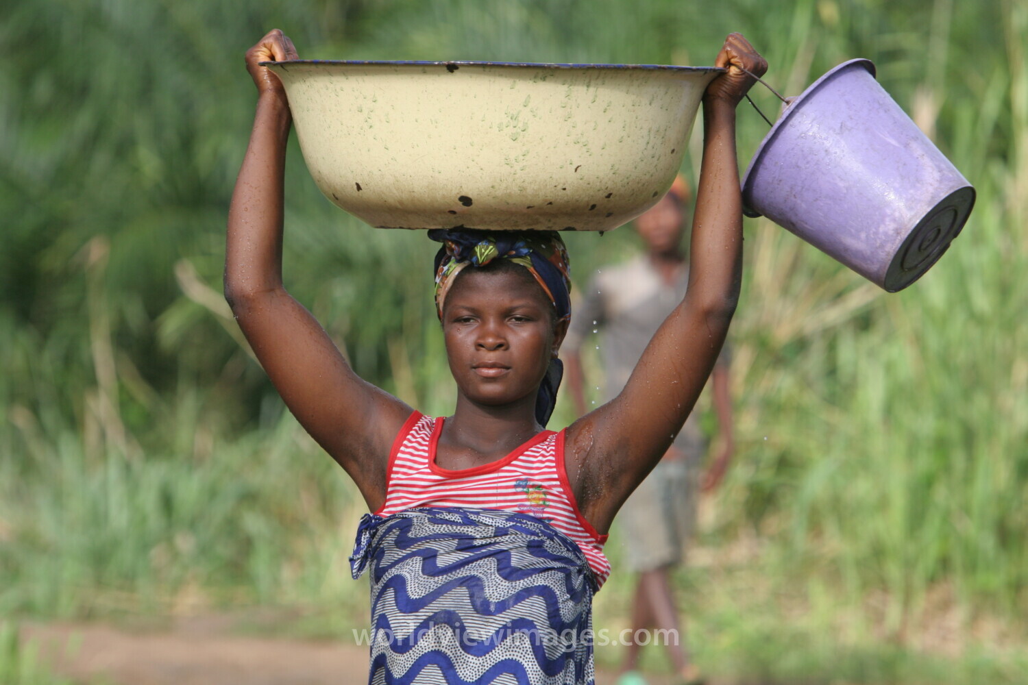 Doing Laundry in the River in Togo