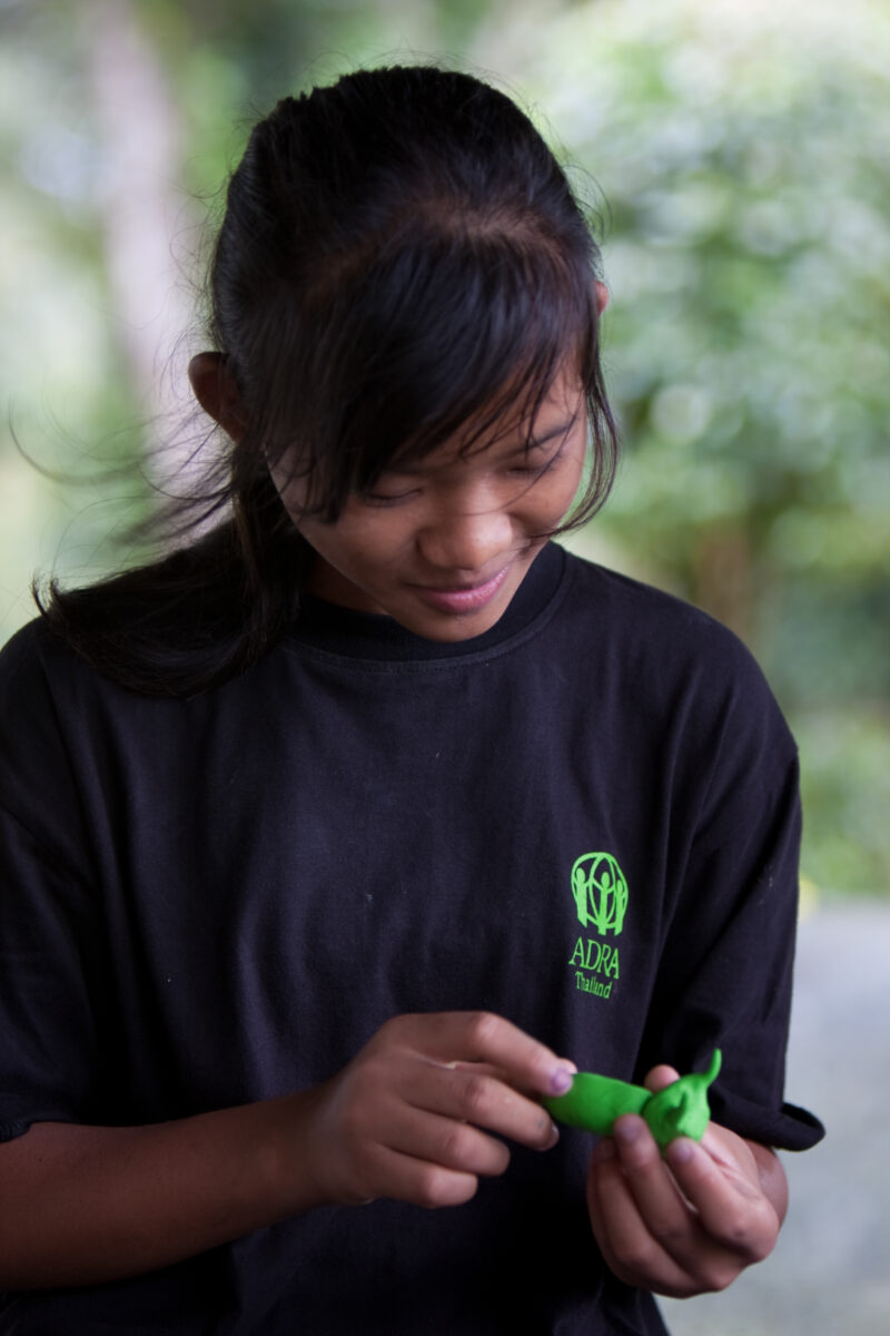 Art Therapy — Young girl in a ADRA program works on a craft — Thailand, ADRA, girl, craft
