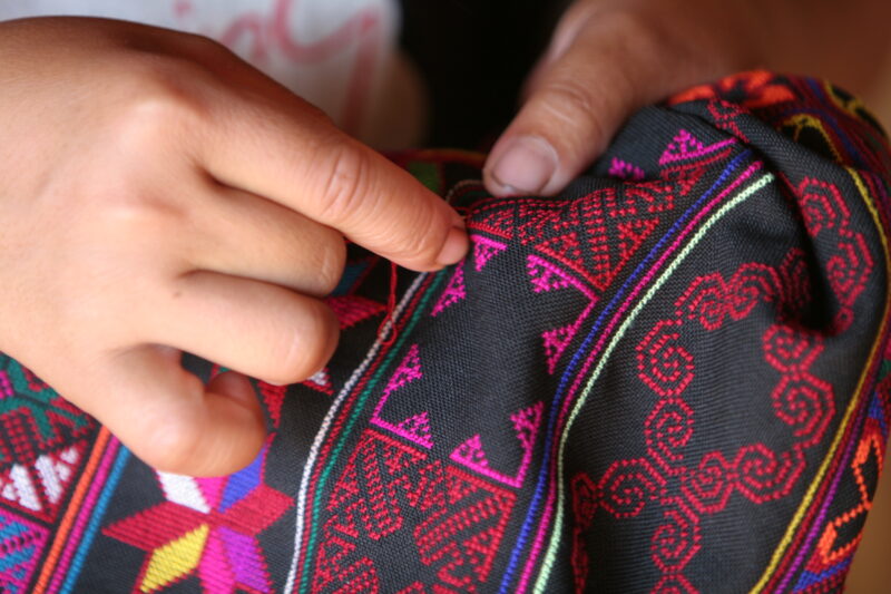 Ethnic Woman does Needlework — Ethnic minority woman works on her handicrafts as part of an income generating activity. — Thailand, ethnic, ethnic minority, ...