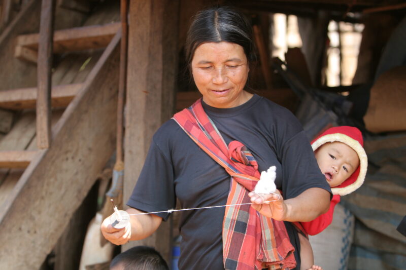 Spinning — Ethnic woman spins thread by hand — Thailand, ethnic, minority, women, spin