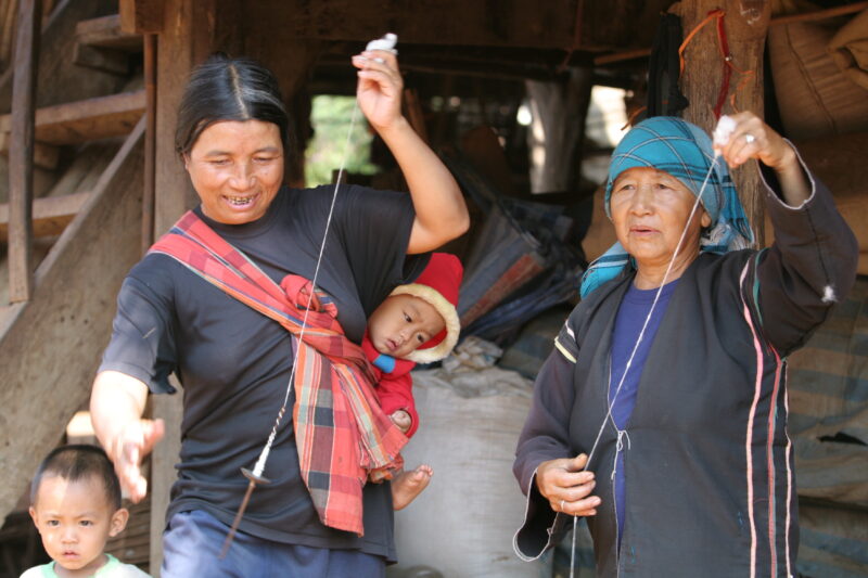 Spinning — Ethnic woman spins thread by hand — Thailand, ethnic, minority, women, spin
