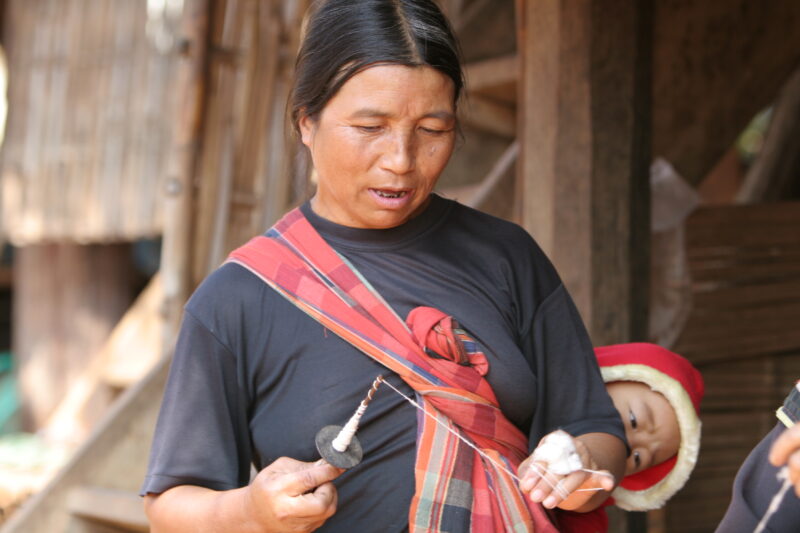 Spinning — Ethnic woman spins thread by hand — Thailand, ethnic, minority, women, spin