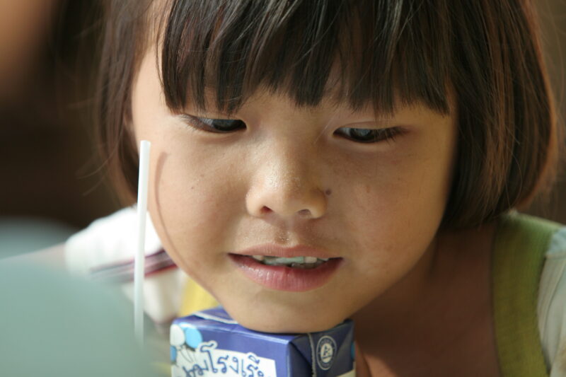 Photo: Girl with Juice Box — Thailand