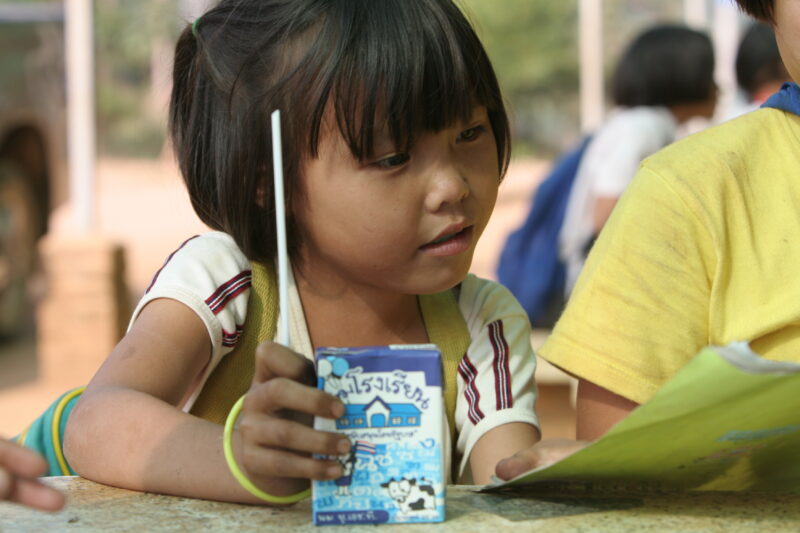 Photo: Girl with Juice Box — Thailand