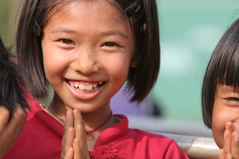 Girl in Thailand — School girls out at recess time at their school in Rural Thailand — Thailand, child, children, girls, smile