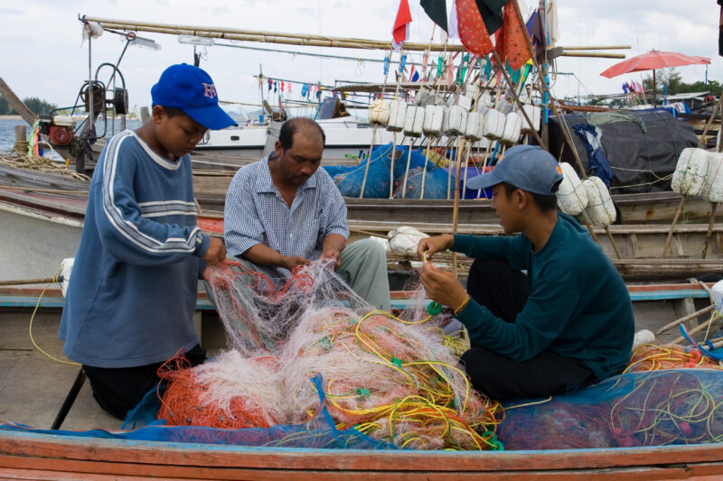 Fishing Nets in Thailand — A fisherman and his sons work with the nets near Phuket Thailand — Thailand, father, son, sons, net