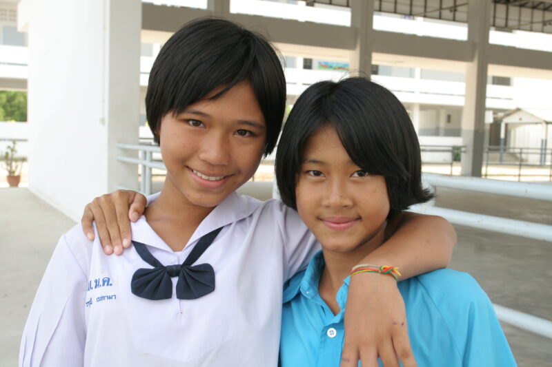 Best Friends — School girls outside their classroom in Phuket, Thailand. — Thailand, girls, faces, Phuket, students