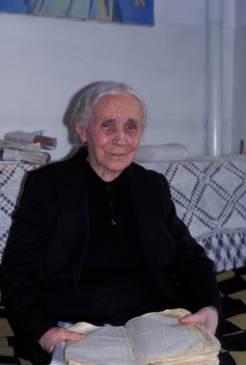 Elder woman in Albania — Elderly Christian woman in Albania reads her Bible — Elderly, elderly, woman, women, old