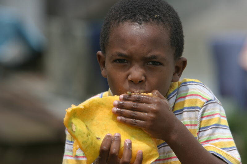 Boy in Sao Tome — Boy enjoys a mango, in Sau Tome, Africa — Sao Tome, Africa, fruit, boy, children