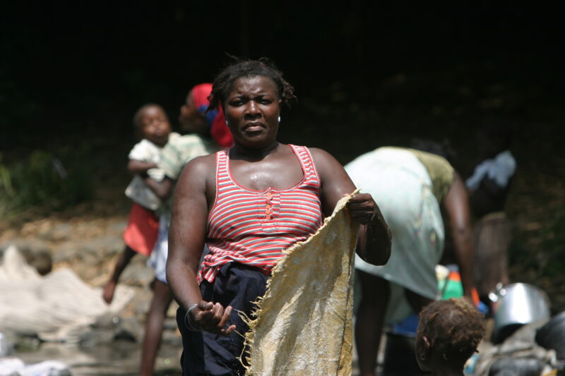 Wash Day in Sao Tome — Stock photos of women washing clothes by hand in a river near their village, in Sao Tome, Africa — Sao Tome, Africa, washing, clothes,...