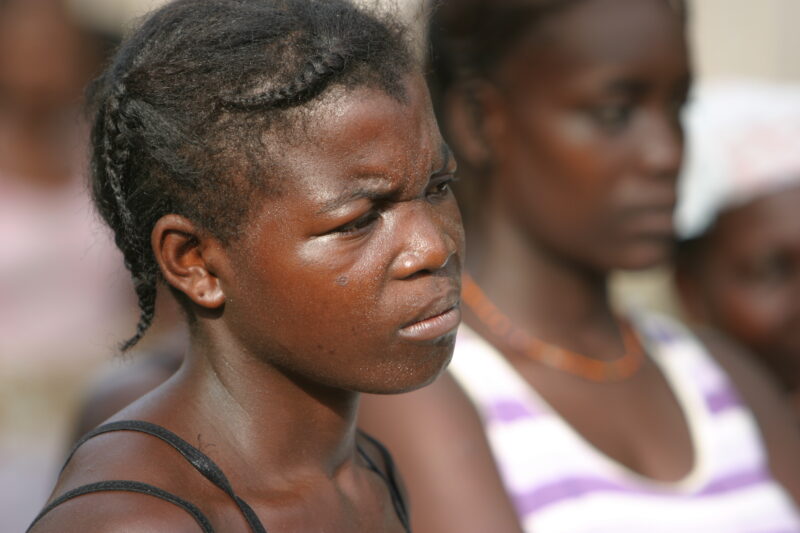 Woman in Sao Tome — Listening to a Health and Wellness seminar held in their village by ADRA — Sao Tome, Africa