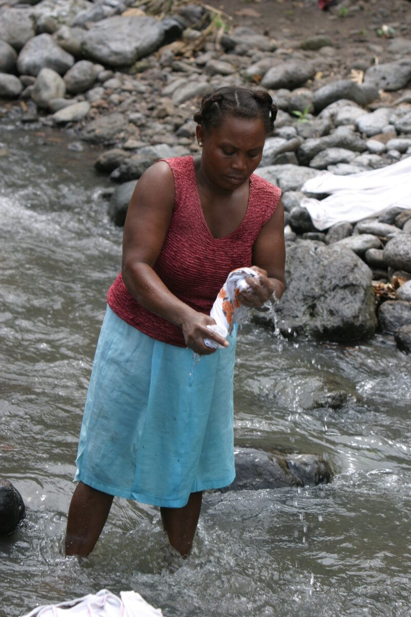 Wash Day — Stock photos of women washing clothes by hand in a river near their village, in Sao Tome, Africa — Sao Tome, Africa, washing, clothes, river