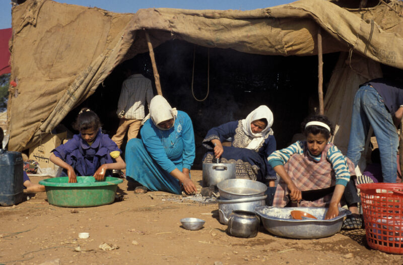 Using Water — Family of field workers in Jordan, showing how they use water, an expensive commodity in Jordan. — Jordan, women, family, cooking, washing