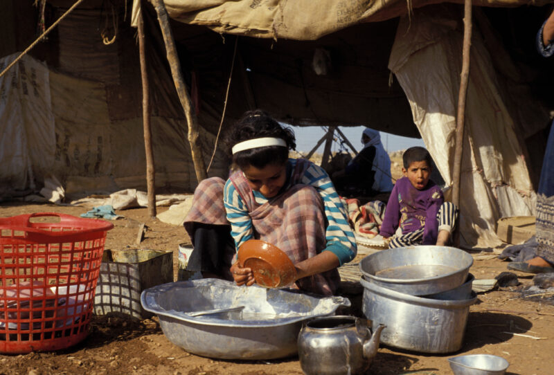 Washing Dishes — Girl of a field working family washes dishes. — Jordan, girl, washing up, washing dishes