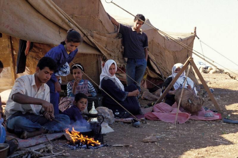 Young man Makes Coffee — Young man, part of a nomadic field working family in Jordan makes coffee for guests — Jordan, family, tent, field workers