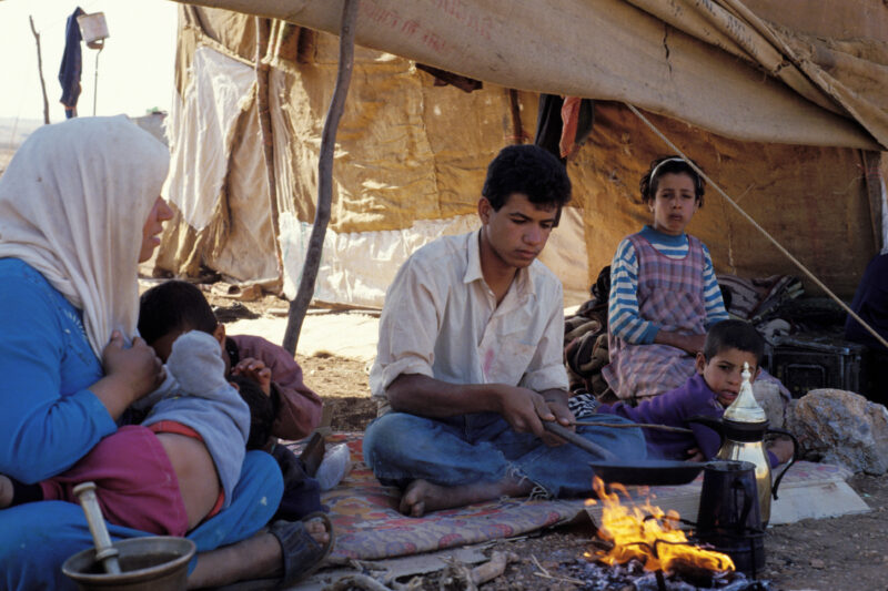 Young man Makes Coffee — Young man, part of a nomadic field working family in Jordan makes coffee for guests. — Jordan, family, tent, field workers