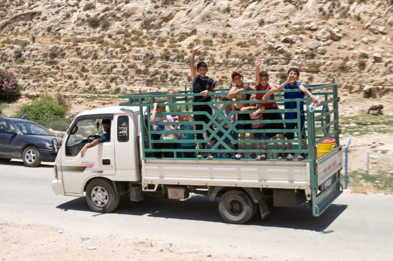 Children in Back — Kids ride in the back of farmers truck in Jordan — Jordan, Children
