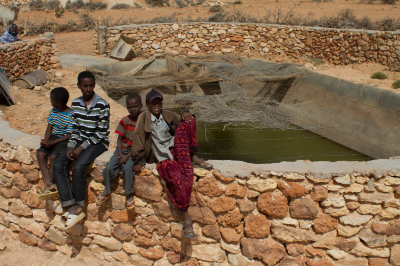 Open Cistern — Open air cistern that is fed by water trucks, in a desert region of Somalia — Africa, East Africa, Somalia, drought, famine